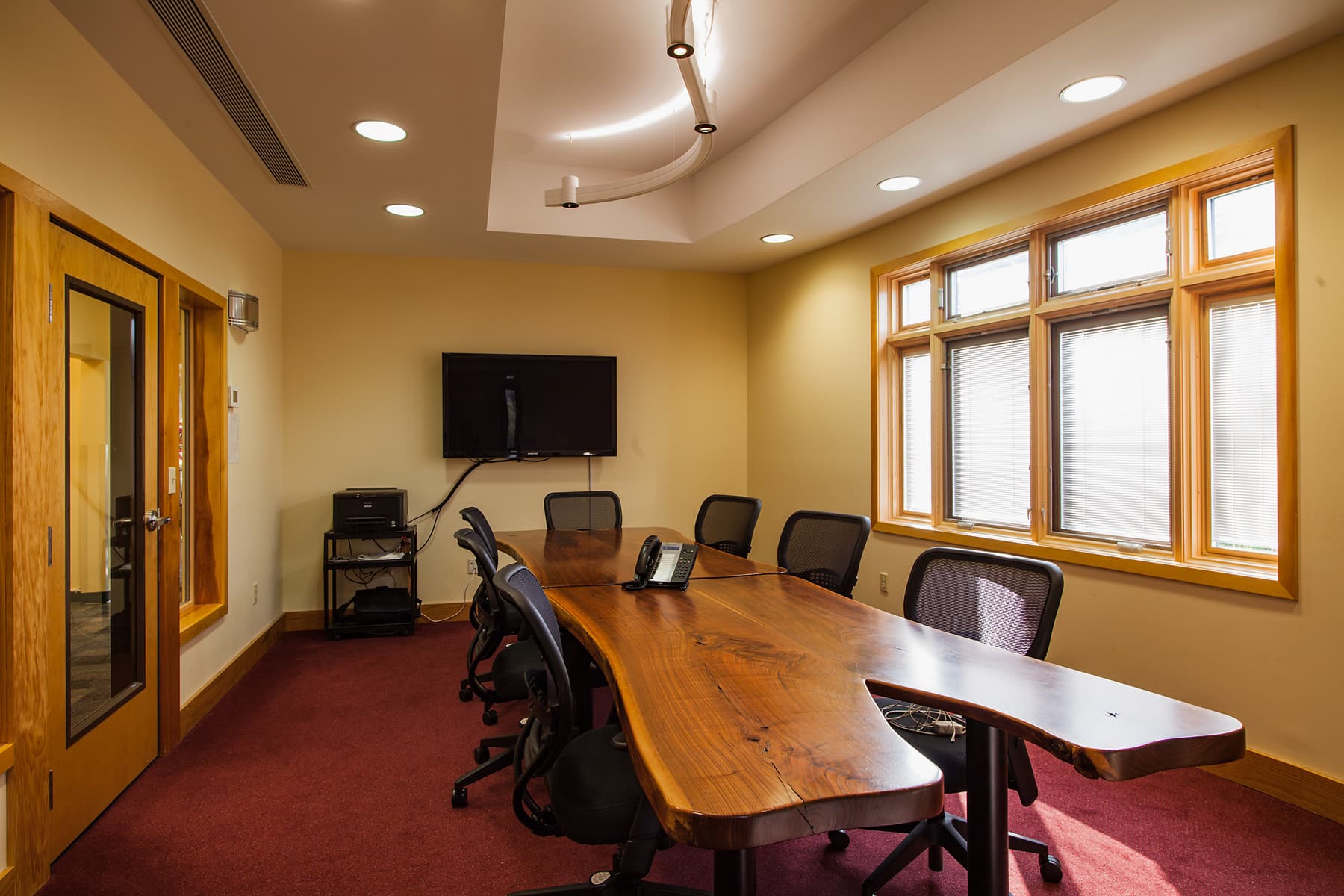 POA meeting room with natural wood table.