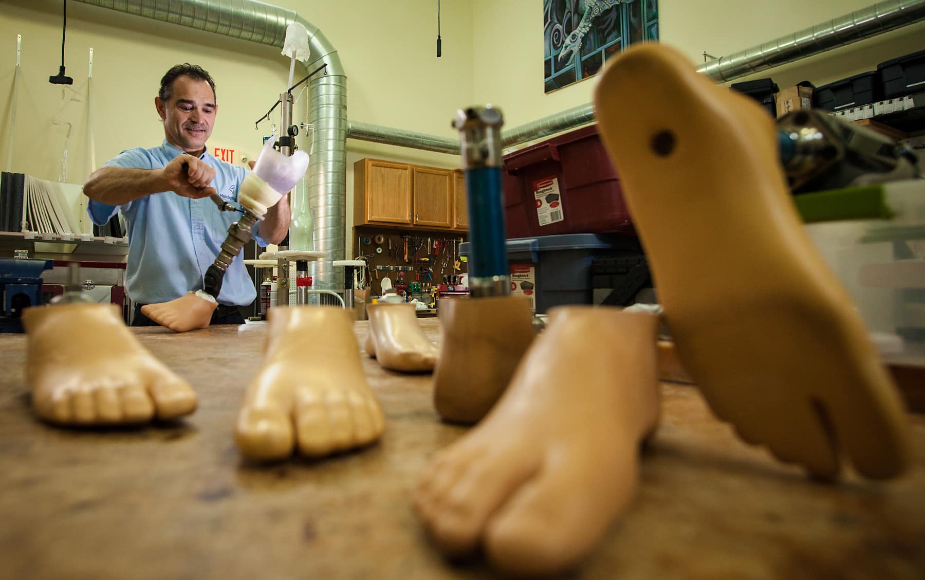POA employee assembling prosthetics. 