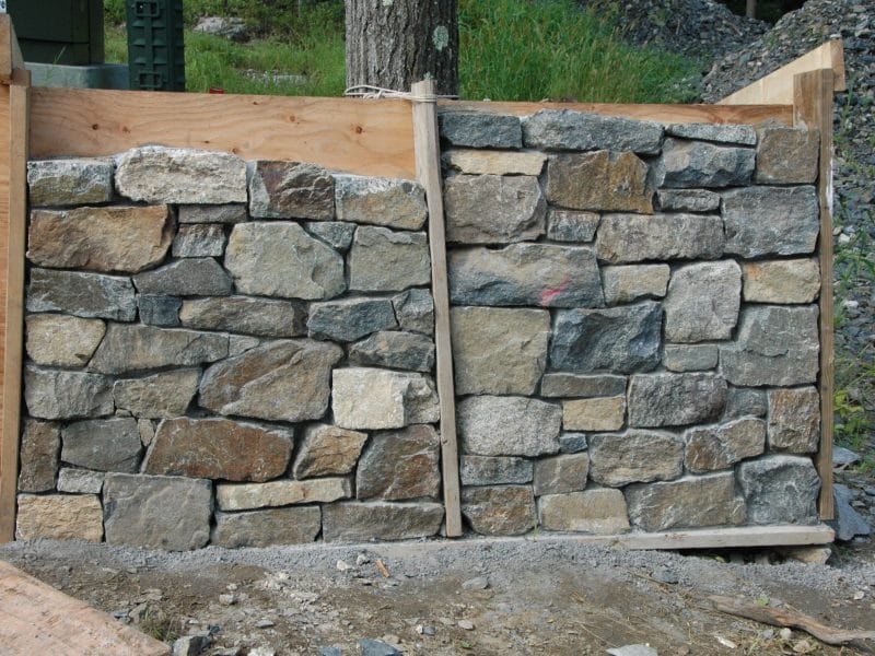 Stone wall samples made by stoneworker before selection.